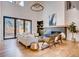 Bright living room with large windows, fireplace, and modern furnishings at 2435 S Josephine St, Denver, CO 80210