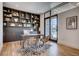 Office featuring built-in shelving, a modern desk, and natural light at 2435 S Josephine St, Denver, CO 80210