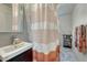 Updated bathroom featuring a clean sink, vanity, and a shower with a patterned curtain at 2819 W 43Rd Ave, Denver, CO 80211