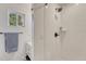 Modern bathroom with subway tile shower, vanity with storage, and window at 2819 W 43Rd Ave, Denver, CO 80211