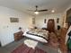 Bedroom featuring a ceiling fan, rugs, a dresser and a comfortable bed with a patterned blanket at 2819 W 43Rd Ave, Denver, CO 80211