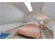 Bright bedroom with slanted ceilings, featuring ample space, natural light, and modern design at 2819 W 43Rd Ave, Denver, CO 80211