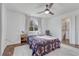 Cozy bedroom with a ceiling fan, and a view to the ensuite bathroom through the doorway at 2819 W 43Rd Ave, Denver, CO 80211
