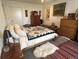 Bedroom with a dresser, bed with a patterned blanket, ceiling fan and bright light at 2819 W 43Rd Ave, Denver, CO 80211