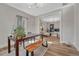 Bright dining room featuring wood floors, a wooden table, and an open view to living room at 2819 W 43Rd Ave, Denver, CO 80211