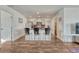 Open-concept kitchen boasting a breakfast bar, white cabinetry, and modern appliances at 2819 W 43Rd Ave, Denver, CO 80211