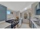 Bright kitchen with stainless steel appliances, plenty of counter space, and natural light at 2819 W 43Rd Ave, Denver, CO 80211
