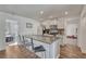Modern kitchen with updated countertops, stainless appliances, and stylish breakfast bar seating at 2819 W 43Rd Ave, Denver, CO 80211