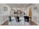 Kitchen with a large island, stainless steel appliances, and bar stool seating at 2819 W 43Rd Ave, Denver, CO 80211