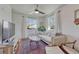 Well-lit living room featuring a comfortable sofa, wooden floors, and stylish decor at 2819 W 43Rd Ave, Denver, CO 80211