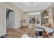 Inviting living room featuring hardwood floors, neutral paint, and an open floor plan to the dining room at 2819 W 43Rd Ave, Denver, CO 80211