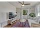 Bright living room with modern decor, a large window, and comfortable seating area at 2819 W 43Rd Ave, Denver, CO 80211