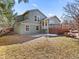 The backyard features a well-maintained lawn, mature trees, and a spacious deck for outdoor enjoyment at 11181 Main Range Trl, Littleton, CO 80127