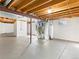 Unfinished basement featuring exposed beams, concrete floor, and modern mechanical systems at 11181 Main Range Trl, Littleton, CO 80127