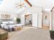 Sun-filled primary bedroom with vaulted ceilings offers ensuite bathroom access and walk-in closet at 11181 Main Range Trl, Littleton, CO 80127