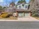 Charming two-story home with a well-maintained lawn and a two-car garage at 11181 Main Range Trl, Littleton, CO 80127