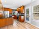 Bright kitchen features modern appliances, custom wood cabinets, and access to an outdoor deck at 11181 Main Range Trl, Littleton, CO 80127