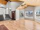 Bright living area with hardwood floors, fireplace and an open staircase at 11181 Main Range Trl, Littleton, CO 80127