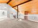 Bright loft featuring vaulted wood ceiling with exposed beams, railing and a view to the floor below at 11181 Main Range Trl, Littleton, CO 80127