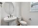 Stylish powder room featuring a modern vanity with a vessel sink and contemporary fixtures at 9257 Truckee Ct, Commerce City, CO 80022