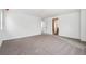 Large bedroom with neutral carpet, light-colored walls, and an open doorway at 9257 Truckee Ct, Commerce City, CO 80022