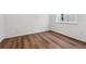 Cozy bedroom with hardwood floors and a bright window at 9257 Truckee Ct, Commerce City, CO 80022