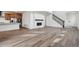 Bright, open-concept living space featuring hardwood floors and contemporary finishes at 9257 Truckee Ct, Commerce City, CO 80022