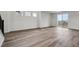 Bright living space with a staircase, hardwood floors, and lots of natural light at 9257 Truckee Ct, Commerce City, CO 80022