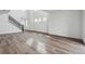 Bright living space with staircase, hardwood floors, and lots of natural light at 9257 Truckee Ct, Commerce City, CO 80022