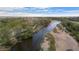 Beautiful aerial view of a winding river cutting through a lush, green landscape on a sunny day at 653 S Hoover Ave, Fort Lupton, CO 80621