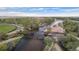 Picturesque aerial view of a pedestrian bridge crossing a river near a baseball field, surrounded by greenery at 653 S Hoover Ave, Fort Lupton, CO 80621