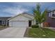 Charming single-Gathering home featuring a well-maintained lawn and an attached two-car garage at 653 S Hoover Ave, Fort Lupton, CO 80621