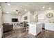 Open-concept living space seamlessly connects the living room, dining area, and kitchen, perfect for entertaining at 653 S Hoover Ave, Fort Lupton, CO 80621