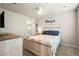Inviting bedroom with ceiling fan, dresser, and a full-sized bed, offering a cozy and peaceful retreat at 653 S Hoover Ave, Fort Lupton, CO 80621