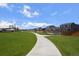 Community walking path, perfect for outdoor exercise, and neighborhood connectivity at 653 S Hoover Ave, Fort Lupton, CO 80621