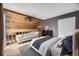 Cozy bedroom features a wooden ceiling and hardwood floors at 2694 S Xanadu Way # D, Aurora, CO 80014