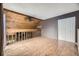 Large bonus room features wood paneling and wooden floors at 2694 S Xanadu Way # D, Aurora, CO 80014