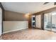 Versatile bonus room with hardwood floors and natural light from the sliding glass doors at 2694 S Xanadu Way # D, Aurora, CO 80014