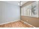Bright dining room with wood paneled walls and wood floors at 2694 S Xanadu Way # D, Aurora, CO 80014