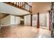 Spacious living room featuring hardwood floors, a fireplace, and access to the outdoors at 2694 S Xanadu Way # D, Aurora, CO 80014
