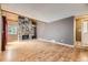 The living room has a stone fireplace, wood accents, and great natural light at 2694 S Xanadu Way # D, Aurora, CO 80014