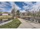 Picturesque pond and bridge with lush landscaping, creating a serene outdoor environment at 2694 S Xanadu Way # D, Aurora, CO 80014