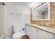 Modern bathroom featuring a stone accent wall and granite countertops at 401 S Kalispell Way # 206, Aurora, CO 80017