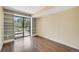 Bright bedroom with large windows leading to a balcony and built-in shelves for extra storage at 401 S Kalispell Way # 206, Aurora, CO 80017