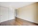 Clean bedroom featuring hardwood floors, closet space and warm paint, ready for personalization at 401 S Kalispell Way # 206, Aurora, CO 80017