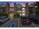 Apartment building with balconies, brick accents, and accessible parking at 401 S Kalispell Way # 206, Aurora, CO 80017