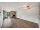 Bright living room features hardwood floors, a stone fireplace and large windows offering natural light at 401 S Kalispell Way # 206, Aurora, CO 80017