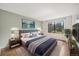 Comfortable main bedroom with a large window and a well-coordinated decor at 401 S Kalispell Way # 206, Aurora, CO 80017