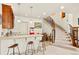 Finished basement with bar, seating, and a grand staircase, perfect for entertaining guests at 2714 Calmante Pl, Superior, CO 80027
