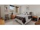 Cozy bedroom with a comfortable bed, neutral tones, and natural light at 2714 Calmante Pl, Superior, CO 80027